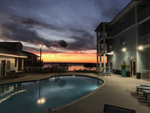 Seasonal outdoor pool, open 9:00 AM to 9 PM, pool umbrellas