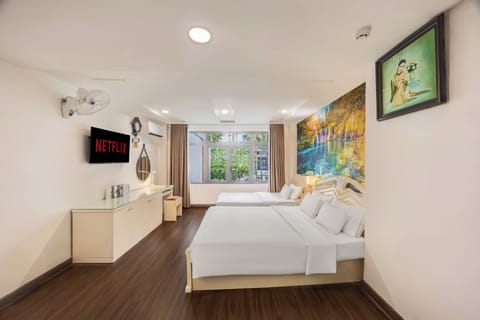 Family Triple Room | Minibar, in-room safe, iron/ironing board, free WiFi