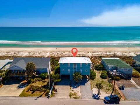 Beachfront property perfectly positioned steps from pristine sandy shores and turquoise waters.
