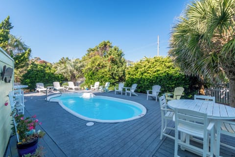 Dive into your private oasis surrounded by lush tropical gardens and comfortable lounge chairs perfect for soaking up the sun.
