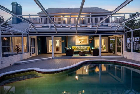 The screened pool and outdoor area provides a comfortable setting to relax and unwind during your stay