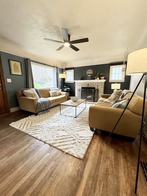 Cozy living room with great seating and big windows offering tons of light!