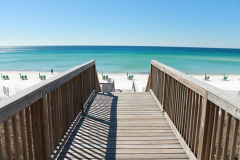 On the beach, white sand, sun loungers, beach umbrellas