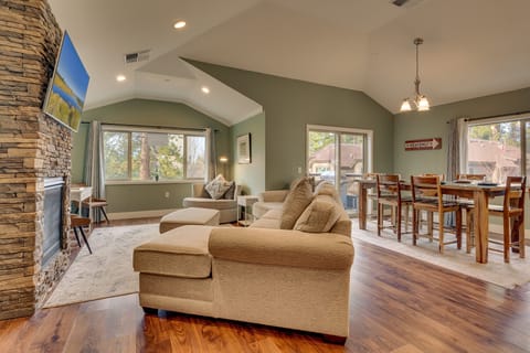 - Open layout with dining and living space  
- Vaulted ceilings and natural light views  
- Spacious vacation rental great room