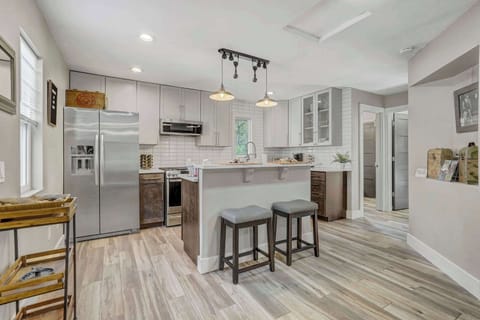Prepare your favorite meals in this stylish kitchen with stainless steel appliances and ample counter space
