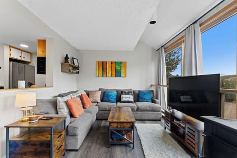 Sink into this cozy sectional and enjoy mountain views through large windows while staying connected with modern entertainment.