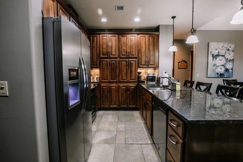 Fully equipped kitchen and bar seating. 