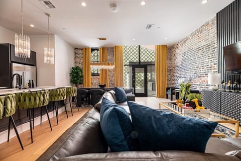 Living Room opens up to pool. Features queen-size sleeper sofa.