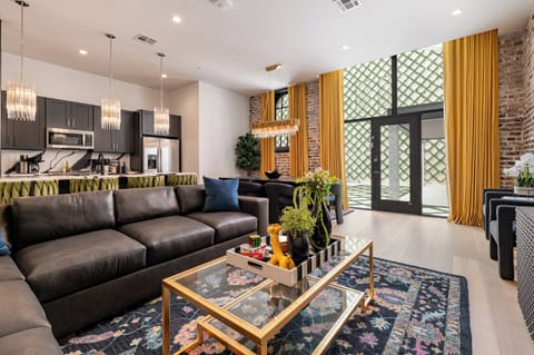 Living Room opens up to pool. Features queen-size sleeper sofa.