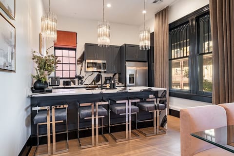 Living room includes queen-size sleeper sofa, dining at table for 8, dining at counter for 4.
Kitchen fully stocked with all cooking essentials.