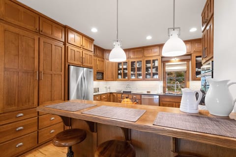 Fully Stocked Kitchen with Preparation Space and Serving Essentials