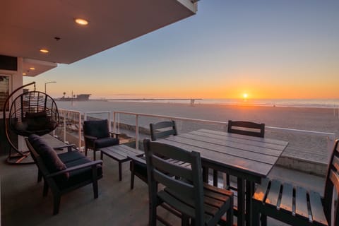 A spacious balcony with ample seating, offering stunning ocean views.