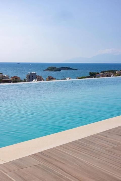 Seasonal outdoor pool, pool umbrellas, sun loungers