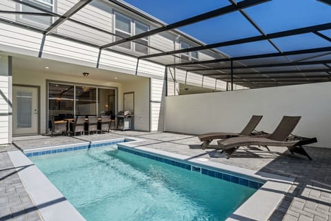 Enjoy outdoor living with a private pool, dining table, BBQ grill.
