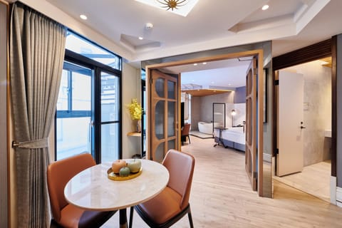 Exclusive Double Room, 1 King Bed | Living room | 65-inch flat-screen TV with cable channels, streaming services