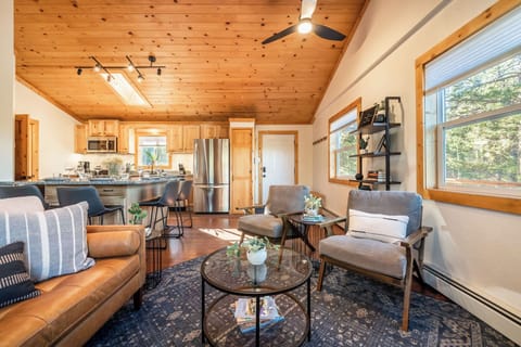 Kick back and relax with a glass of wine on the leather sofa with chaise lounge and two comfy chairs. Curls up in front of the wood burning stove the with a good book while enjoying its warmth and ambiance.