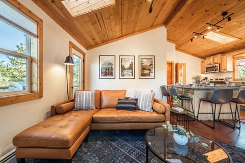 This cozy mid century modern, all leather couch, is the perfect spot for an evening cocktail, morning cup of joe and a good conversation with friends.