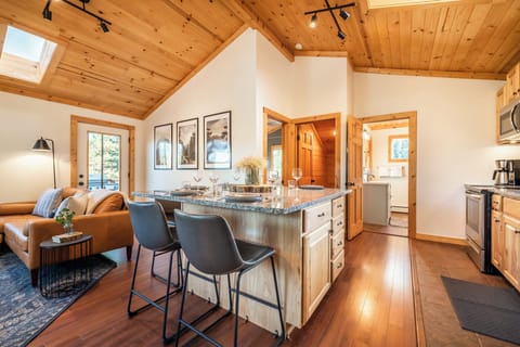 The large and spacious granite counter top doubles as an open-concept dining area. The table seats six and has plenty of space for that Thanksgiving Turkey and all the sides! During the colder months enjoy the heat from the fire place while you dine.