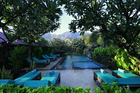 Outdoor pool, open 7:00 AM to 7:00 PM, pool umbrellas, sun loungers