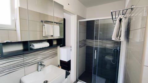 Double Room | Bathroom | Shower, towels, toilet paper