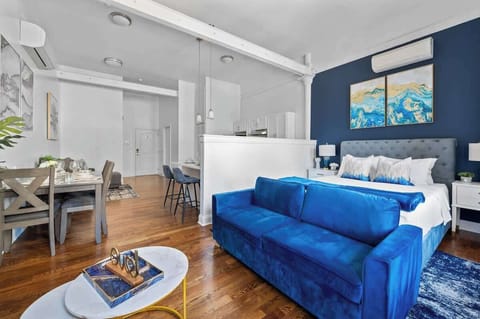 Open concept studio apartment with plenty of natural sunlight
