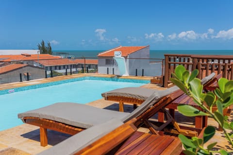 Outdoor pool, open 9:00 AM to 9:00 PM, pool umbrellas, sun loungers