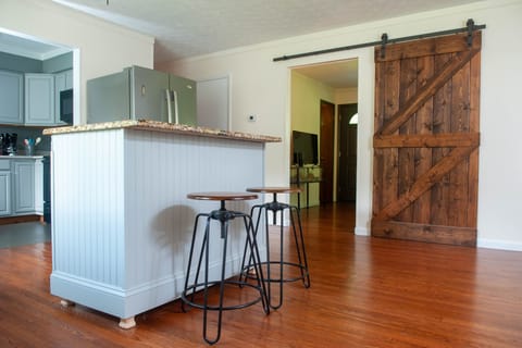 Handmade island with storage, water dispenser, fridge/freezer and kitchen. 