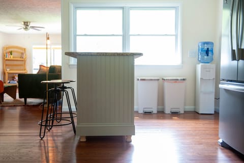 Handmade island with storage, water dispenser, fridge/freezer and kitchen. 