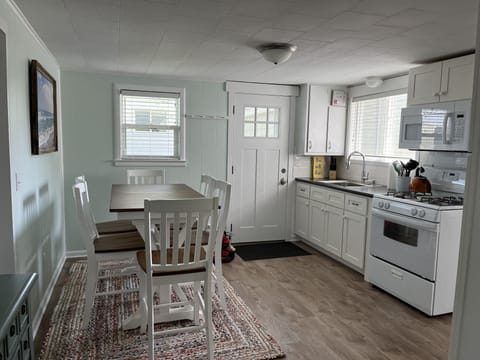 Another view of the kitchen and side door to courtyard.