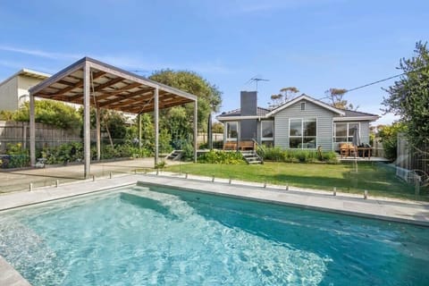 The ultimate garden setting with a glistening solar-heated swimming pool