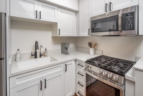 The kitchen is fully equipped with all cooking essentials.