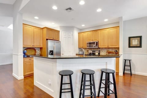 Guests can sit and relax on the stools leading up to the kitchen counter