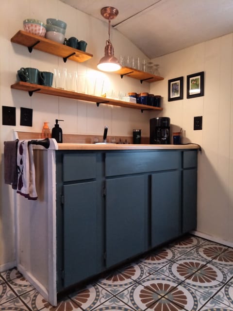 kitchen with cookware and everything you need to cook inside or on the grill.