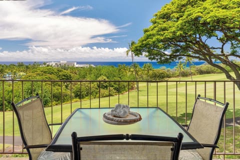 Stunning ocean and golf course views from this private balcony, perfect for morning coffee or evening relaxation with tropical breezes.