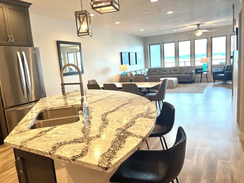 Open floor plan allows for conversations, lake views, and sunsets while cooking