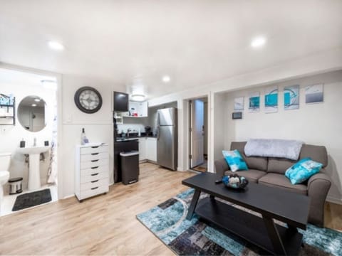 view of living room, kitchen, bathroom