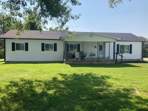 Completely remodeled country home with covered front porch with seating for 6+