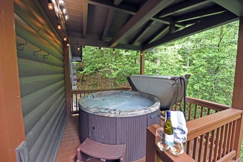 The secluded hot tub area features towels and robes for your enjoyment. 