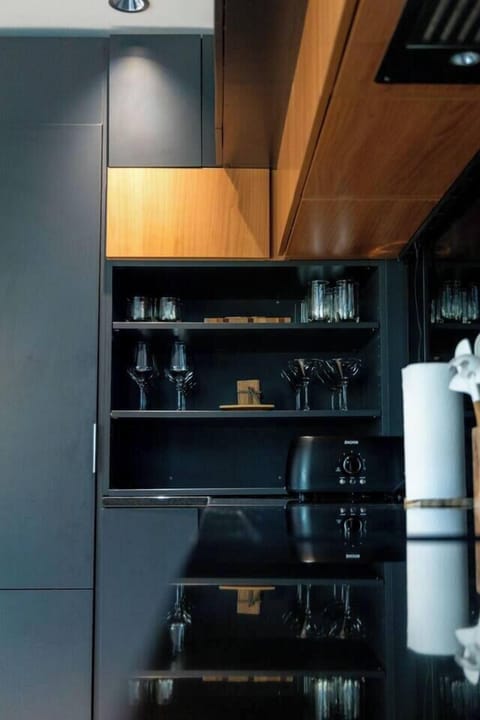 Fully equipped kitchen with modern appliances, ample counter space, and all the essentials needed to cook and dine in comfort.