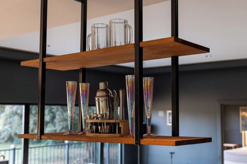 Well-organized kitchen rack displaying a collection of glasses, adding both functionality and a touch of elegance to the space.