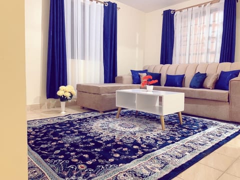Business Apartment | Living area | 24-inch Smart TV with digital channels