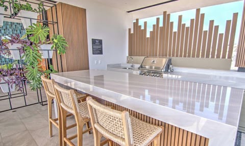 Mina Bucerias rooftop with shared pool and grill area