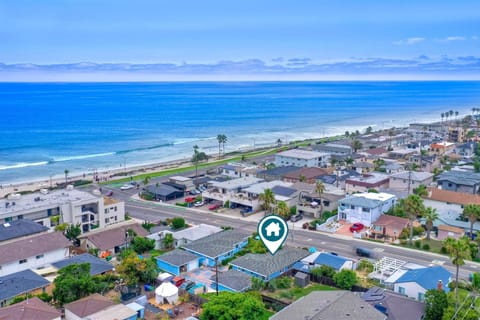Located one block from the beach, a great surf break, and dining