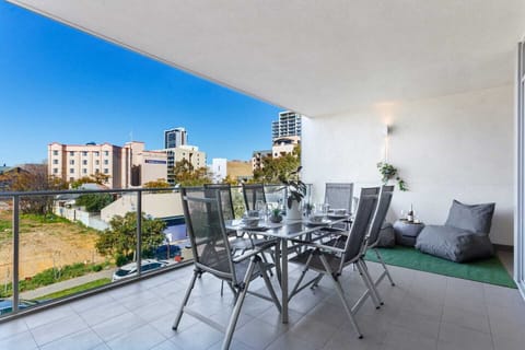 Outdoor dining with city views.