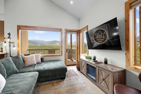 The living room has plenty of windows with gorgeous views.