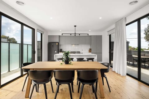 Light-filled dining room comfortably seating eight people.