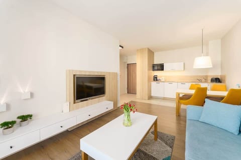 Relax in the stylish living room with a comfortable sofa and modern decor.