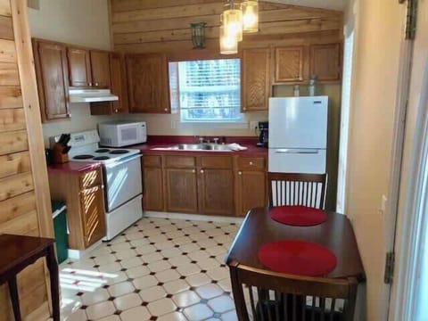 Full kitchen with dining area.
