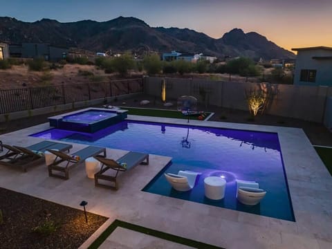 “Twilight tranquility by the poolside, where every moment feels like a serene escape. 🌌💦 #EveningVibes #PoolsideRelaxation”