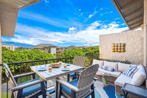 Step outside to your private partially covered lanai, complete with an outdoor dining set and comfy sectional seating overlooking lush tropical views.